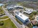 An aerial view of a community commercial center with shops, restaurants, and ample parking at 243 Island Breeze Ave, Daytona Beach, FL 32124