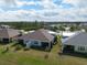 A view of the back of the home featuring a screened in lanai at 243 Island Breeze Ave, Daytona Beach, FL 32124