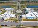 Aerial view of community buildings with parking, roads, and landscaping at 243 Island Breeze Ave, Daytona Beach, FL 32124