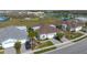 Aerial view shows the home's paver driveway and landscaping at 243 Island Breeze Ave, Daytona Beach, FL 32124