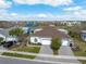 Aerial shot of home featuring paver driveway and community recreational facilities at 243 Island Breeze Ave, Daytona Beach, FL 32124