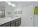 Bright bathroom with a large mirror, modern vanity, and a well-lit space at 243 Island Breeze Ave, Daytona Beach, FL 32124