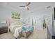 Inviting bedroom with a comfortable bed, stylish decor, and a ceiling fan for added comfort at 243 Island Breeze Ave, Daytona Beach, FL 32124