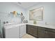 Well-equipped laundry room featuring a modern washer and dryer and plenty of storage space at 243 Island Breeze Ave, Daytona Beach, FL 32124