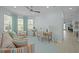 Inviting sitting area with comfortable striped furniture, a desk, and bright windows at 243 Island Breeze Ave, Daytona Beach, FL 32124