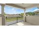 Balcony with black metal railing and view of the neighborhood at 3411 Gallia St, New Smyrna Beach, FL 32168