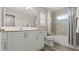 Well-lit bathroom with double vanity and shower-tub combo at 3411 Gallia St, New Smyrna Beach, FL 32168