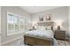 Well-lit bedroom with shuttered windows and a decorative rug at 3411 Gallia St, New Smyrna Beach, FL 32168