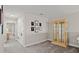 Upstairs hallway with display cabinet and doorway to a bedroom at 3411 Gallia St, New Smyrna Beach, FL 32168