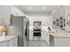 Well-equipped kitchen featuring sleek stainless steel appliances, and white cabinetry at 3411 Gallia St, New Smyrna Beach, FL 32168