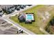 Aerial view of the community pool with lounge chairs and a seating area at 3411 Gallia St, New Smyrna Beach, FL 32168