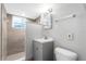 Bathroom featuring a shower, modern vanity, and toilet at 630 W Rich Ave, Deland, FL 32720