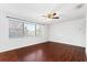 Bright bedroom with wood floors, large window, and a ceiling fan at 630 W Rich Ave, Deland, FL 32720