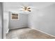 Cozy bedroom with wainscoting, ceiling fan, and tile flooring at 630 W Rich Ave, Deland, FL 32720