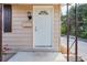 Exterior of a home showcasing the front door, mail slot, and porch light at 630 W Rich Ave, Deland, FL 32720