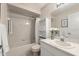 Inviting bathroom featuring a shower-tub combo and a neutral-toned vanity at 66 Old Sunbeam Dr, South Daytona, FL 32119