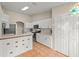 An inviting kitchen with white cabinetry, stainless steel appliances, and stylish tiled accents at 66 Old Sunbeam Dr, South Daytona, FL 32119