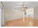 Open living room features neutral walls, tile floors and a ceiling fan at 66 Old Sunbeam Dr, South Daytona, FL 32119