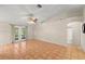 Bright living room features tile floors, ceiling fan and French doors to the yard at 66 Old Sunbeam Dr, South Daytona, FL 32119