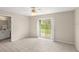 Main bedroom featuring a ceiling fan, walk-in closet and bathroom at 66 Old Sunbeam Dr, South Daytona, FL 32119