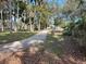 Scenic walking path winds through lush green spaces with many trees and verdant foilage at 66 Old Sunbeam Dr, South Daytona, FL 32119