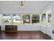 Bright sunroom with lots of windows and wood-look floors at 8885 Sw 95Th St # C, Ocala, FL 34481