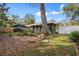 Backyard with partial view of the screened-in porch at 1054 W Samms Ave, Port Orange, FL 32129