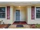 Close up on the entryway with a screen door and decorative shutters, perfect for making a great first impression at 1054 W Samms Ave, Port Orange, FL 32129