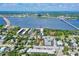 Aerial view of waterfront condo community nestled in a tropical landscape at 118 S Halifax Ave # 103, Daytona Beach, FL 32118