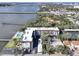 Aerial view showcasing the condo community, lush greenery, and waterfront access at 118 S Halifax Ave # 103, Daytona Beach, FL 32118