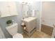 Stylish bathroom features neutral tones, updated fixtures, and a tiled floor at 118 S Halifax Ave # 103, Daytona Beach, FL 32118