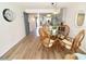 Dining room area with a view of the kitchen and blue sliding barn door at 118 S Halifax Ave # 103, Daytona Beach, FL 32118