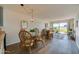 Open concept dining room and living room combo with water view at 118 S Halifax Ave # 103, Daytona Beach, FL 32118