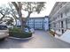 Exterior view of the condominium complex with a parking lot at 118 S Halifax Ave # 103, Daytona Beach, FL 32118