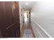 Inviting entry hallway with wood floors, decorative mirror, and elegant trim at 118 S Halifax Ave # 103, Daytona Beach, FL 32118