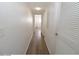 Long hallway featuring access to the bedrooms and other rooms at 118 S Halifax Ave # 103, Daytona Beach, FL 32118