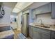 Modern kitchen with stainless steel appliances, granite counters, and ample cabinet space at 118 S Halifax Ave # 103, Daytona Beach, FL 32118