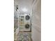 Convenient laundry area with stackable washer and dryer and extra storage at 118 S Halifax Ave # 103, Daytona Beach, FL 32118