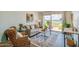 Comfortable living room with a plush sofa, natural light, and views of the surrounding landscape at 118 S Halifax Ave # 103, Daytona Beach, FL 32118