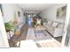 Cozy living room area with view through dining room and out to front entry at 118 S Halifax Ave # 103, Daytona Beach, FL 32118