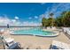 Community pool with waterfront views and plenty of lounge seating and tables at 118 S Halifax Ave # 103, Daytona Beach, FL 32118