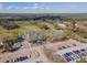 Stunning aerial view of the community clubhouse and golf course offering luxurious amenities and scenic landscapes at 1187 Athlone Way, Ormond Beach, FL 32174