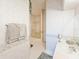 Bathroom featuring a glass-enclosed shower, sink and linen closet at 1187 Athlone Way, Ormond Beach, FL 32174