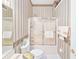 Well-lit bathroom featuring a shower/tub combination and a white tile floor at 1187 Athlone Way, Ormond Beach, FL 32174
