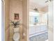 Well-appointed bathroom with a toilet, vanity, and access to a mirrored vanity area at 1187 Athlone Way, Ormond Beach, FL 32174