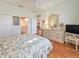 Spacious bedroom with hardwood floors, double closets, and decorative elements at 1187 Athlone Way, Ormond Beach, FL 32174