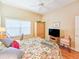 Inviting bedroom features a large window, ceiling fan, and ample storage space at 1187 Athlone Way, Ormond Beach, FL 32174
