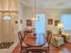 Elegant dining room with a chandelier, hardwood floors and plenty of natural light at 1187 Athlone Way, Ormond Beach, FL 32174