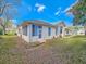 Well-maintained house featuring manicured landscaping, screen porch and a lush lawn at 1187 Athlone Way, Ormond Beach, FL 32174
