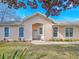 Attractive single-story home featuring a covered entrance and manicured front yard at 1187 Athlone Way, Ormond Beach, FL 32174